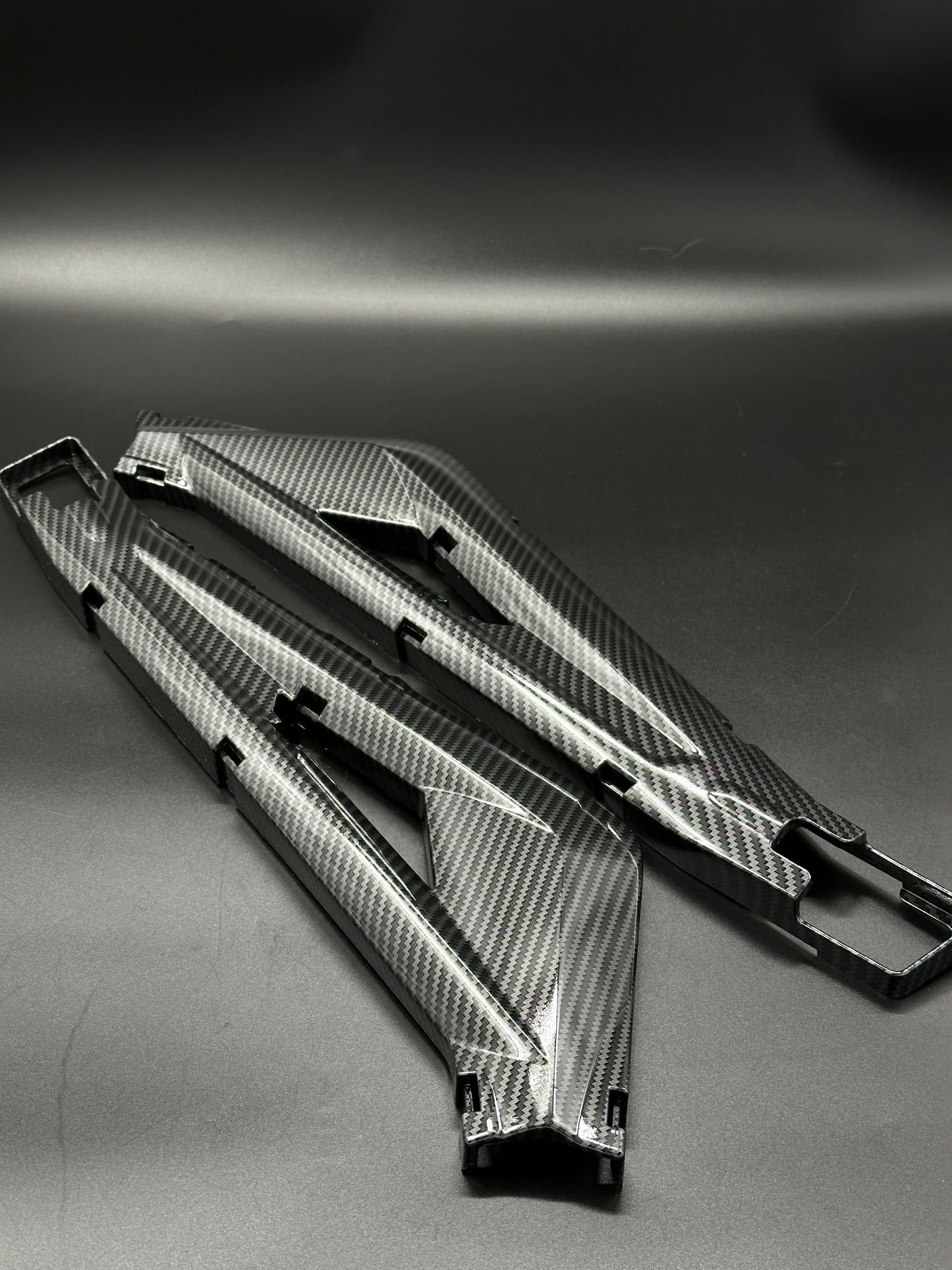 Surron Light Bee Swing Arm Protectors (Carbon Dipped)