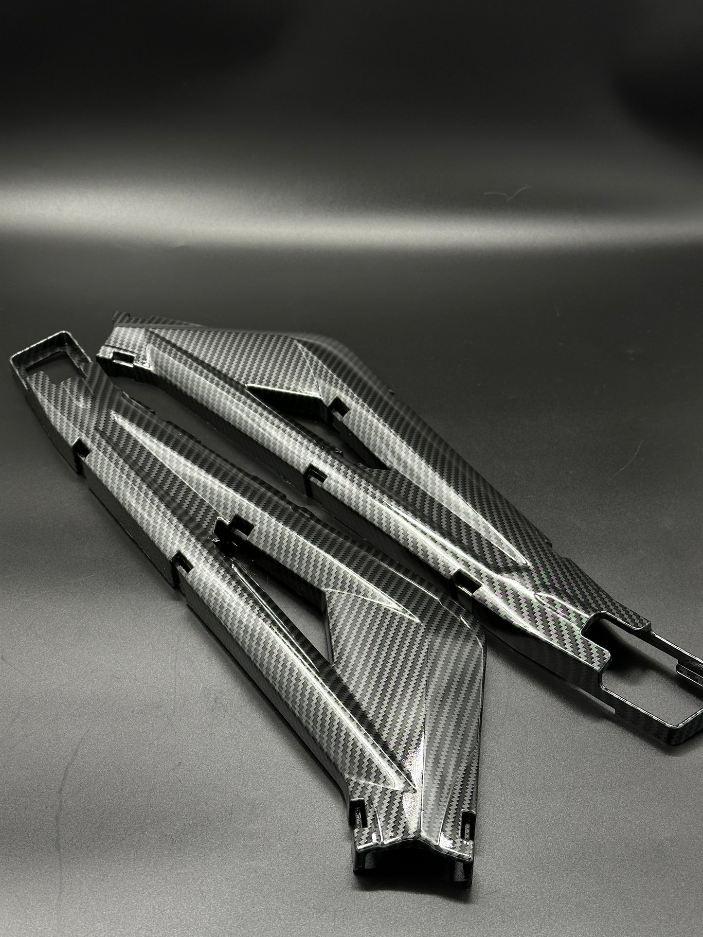 Surron Light Bee Swing Arm Protectors (Carbon Dipped)